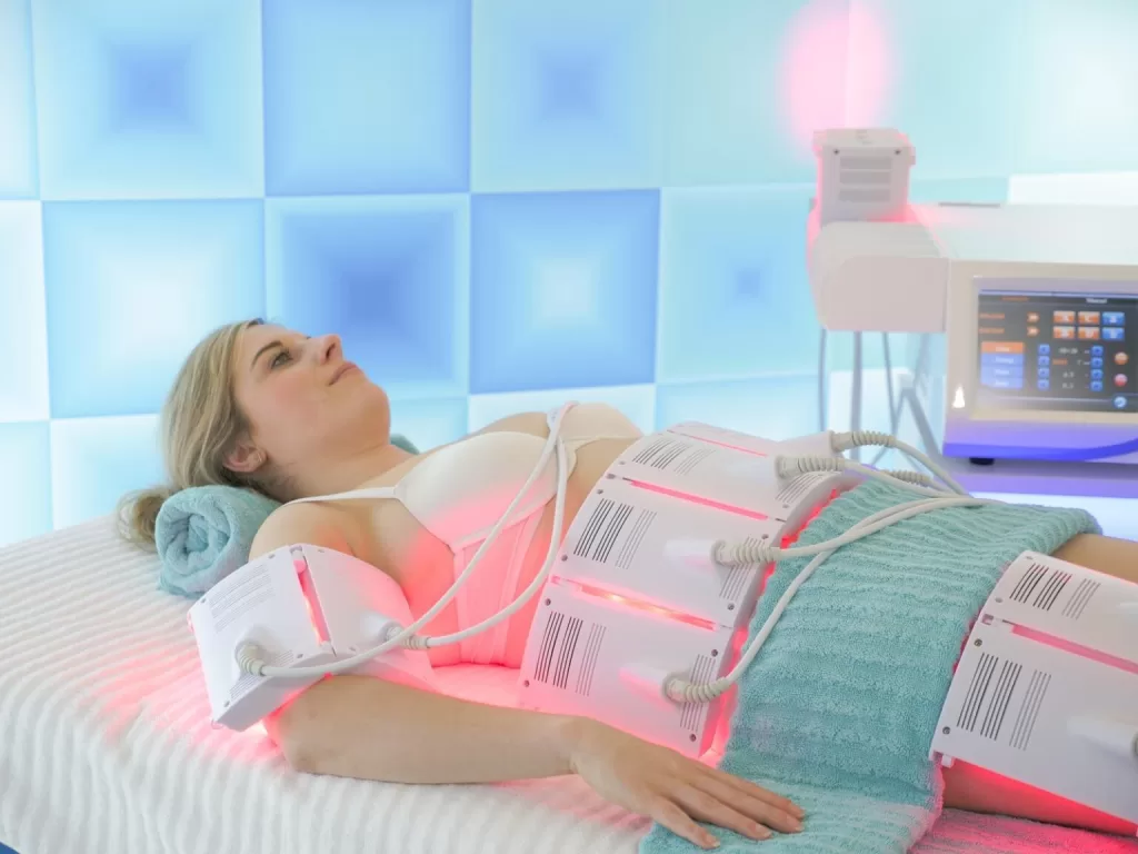 laser lipolysis treatment on the female's abdomen